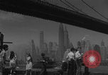 Image of children playing under Brooklyn Bridge New York City USA, 1944, second 31 stock footage video 65675080373