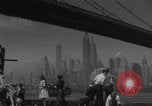 Image of children playing under Brooklyn Bridge New York City USA, 1944, second 33 stock footage video 65675080373