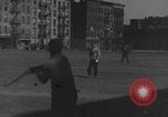 Image of boys playing baseball New York City USA, 1944, second 28 stock footage video 65675080380