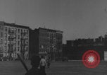 Image of boys playing baseball New York City USA, 1944, second 29 stock footage video 65675080380