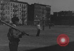Image of boys playing baseball New York City USA, 1944, second 33 stock footage video 65675080380