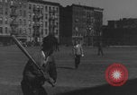 Image of boys playing baseball New York City USA, 1944, second 34 stock footage video 65675080380