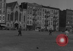 Image of boys playing baseball New York City USA, 1944, second 48 stock footage video 65675080380