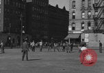 Image of boys playing baseball New York City USA, 1944, second 62 stock footage video 65675080380