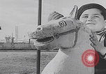 Image of children ride carousel Italy, 1950, second 3 stock footage video 65675080391