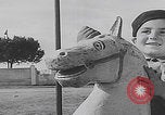 Image of children ride carousel Italy, 1950, second 4 stock footage video 65675080391