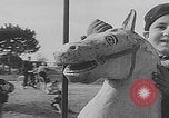Image of children ride carousel Italy, 1950, second 5 stock footage video 65675080391