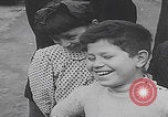 Image of children ride carousel Italy, 1950, second 14 stock footage video 65675080391