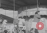 Image of children ride carousel Italy, 1950, second 29 stock footage video 65675080391