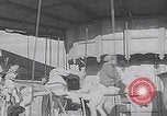 Image of children ride carousel Italy, 1950, second 39 stock footage video 65675080391