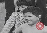 Image of children ride carousel Italy, 1950, second 45 stock footage video 65675080391