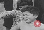 Image of children ride carousel Italy, 1950, second 46 stock footage video 65675080391