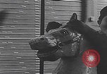 Image of children ride carousel Italy, 1950, second 52 stock footage video 65675080391