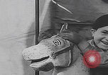 Image of children ride carousel Italy, 1950, second 54 stock footage video 65675080391