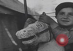 Image of children ride carousel Italy, 1950, second 60 stock footage video 65675080391