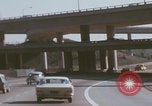Image of cars drive highway United States USA, 1968, second 12 stock footage video 65675080425
