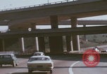 Image of cars drive highway United States USA, 1968, second 13 stock footage video 65675080425