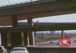 Image of cars drive highway United States USA, 1968, second 14 stock footage video 65675080425