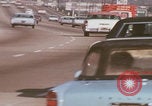 Image of cars drive highway United States USA, 1968, second 21 stock footage video 65675080425