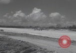 Image of Consolidated B-24 Liberator bombers landing Angaur Palau Islands, 1944, second 48 stock footage video 65675080435