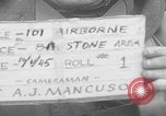 Image of 101st Airborne marching in snow Bastogne Belgium, 1945, second 5 stock footage video 65675080486
