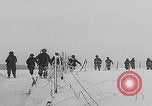 Image of 101st Airborne marching in snow Bastogne Belgium, 1945, second 6 stock footage video 65675080486