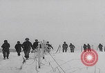 Image of 101st Airborne marching in snow Bastogne Belgium, 1945, second 7 stock footage video 65675080486