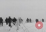 Image of 101st Airborne marching in snow Bastogne Belgium, 1945, second 8 stock footage video 65675080486
