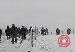 Image of 101st Airborne marching in snow Bastogne Belgium, 1945, second 10 stock footage video 65675080486