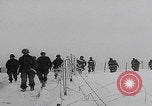 Image of 101st Airborne marching in snow Bastogne Belgium, 1945, second 11 stock footage video 65675080486