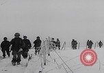 Image of 101st Airborne marching in snow Bastogne Belgium, 1945, second 12 stock footage video 65675080486