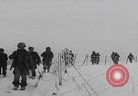 Image of 101st Airborne marching in snow Bastogne Belgium, 1945, second 13 stock footage video 65675080486