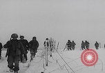 Image of 101st Airborne marching in snow Bastogne Belgium, 1945, second 14 stock footage video 65675080486