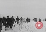 Image of 101st Airborne marching in snow Bastogne Belgium, 1945, second 16 stock footage video 65675080486