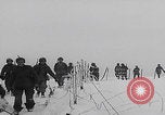 Image of 101st Airborne marching in snow Bastogne Belgium, 1945, second 17 stock footage video 65675080486