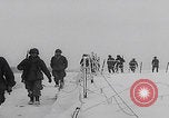 Image of 101st Airborne marching in snow Bastogne Belgium, 1945, second 20 stock footage video 65675080486