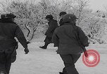 Image of 101st Airborne marching in snow Bastogne Belgium, 1945, second 23 stock footage video 65675080486