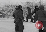 Image of 101st Airborne marching in snow Bastogne Belgium, 1945, second 24 stock footage video 65675080486