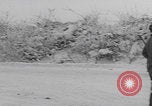 Image of 101st Airborne marching in snow Bastogne Belgium, 1945, second 25 stock footage video 65675080486