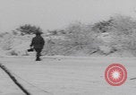 Image of 101st Airborne marching in snow Bastogne Belgium, 1945, second 26 stock footage video 65675080486