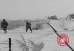 Image of 101st Airborne marching in snow Bastogne Belgium, 1945, second 27 stock footage video 65675080486