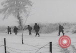 Image of 101st Airborne marching in snow Bastogne Belgium, 1945, second 28 stock footage video 65675080486
