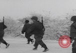 Image of 101st Airborne marching in snow Bastogne Belgium, 1945, second 31 stock footage video 65675080486
