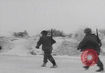 Image of 101st Airborne marching in snow Bastogne Belgium, 1945, second 32 stock footage video 65675080486