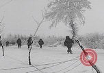 Image of 101st Airborne marching in snow Bastogne Belgium, 1945, second 36 stock footage video 65675080486
