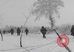 Image of 101st Airborne marching in snow Bastogne Belgium, 1945, second 37 stock footage video 65675080486