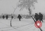 Image of 101st Airborne marching in snow Bastogne Belgium, 1945, second 39 stock footage video 65675080486