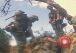 Image of soldiers in jungle Vietnam War Vietnam, 1968, second 1 stock footage video 65675080524