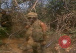 Image of soldiers in jungle Vietnam War Vietnam, 1968, second 20 stock footage video 65675080524