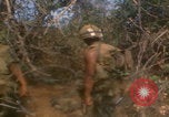 Image of soldiers in jungle Vietnam War Vietnam, 1968, second 22 stock footage video 65675080524
